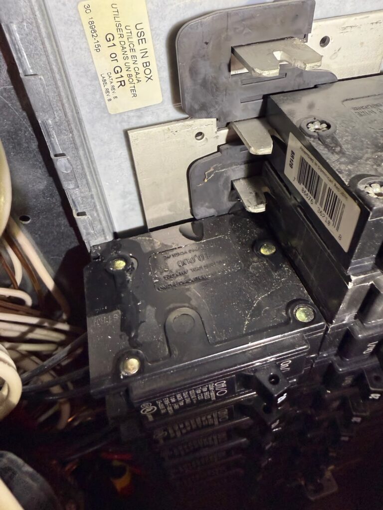 Close-up of storm-proof outdoor electrical outlet with weatherproof cover, TriCities Electric